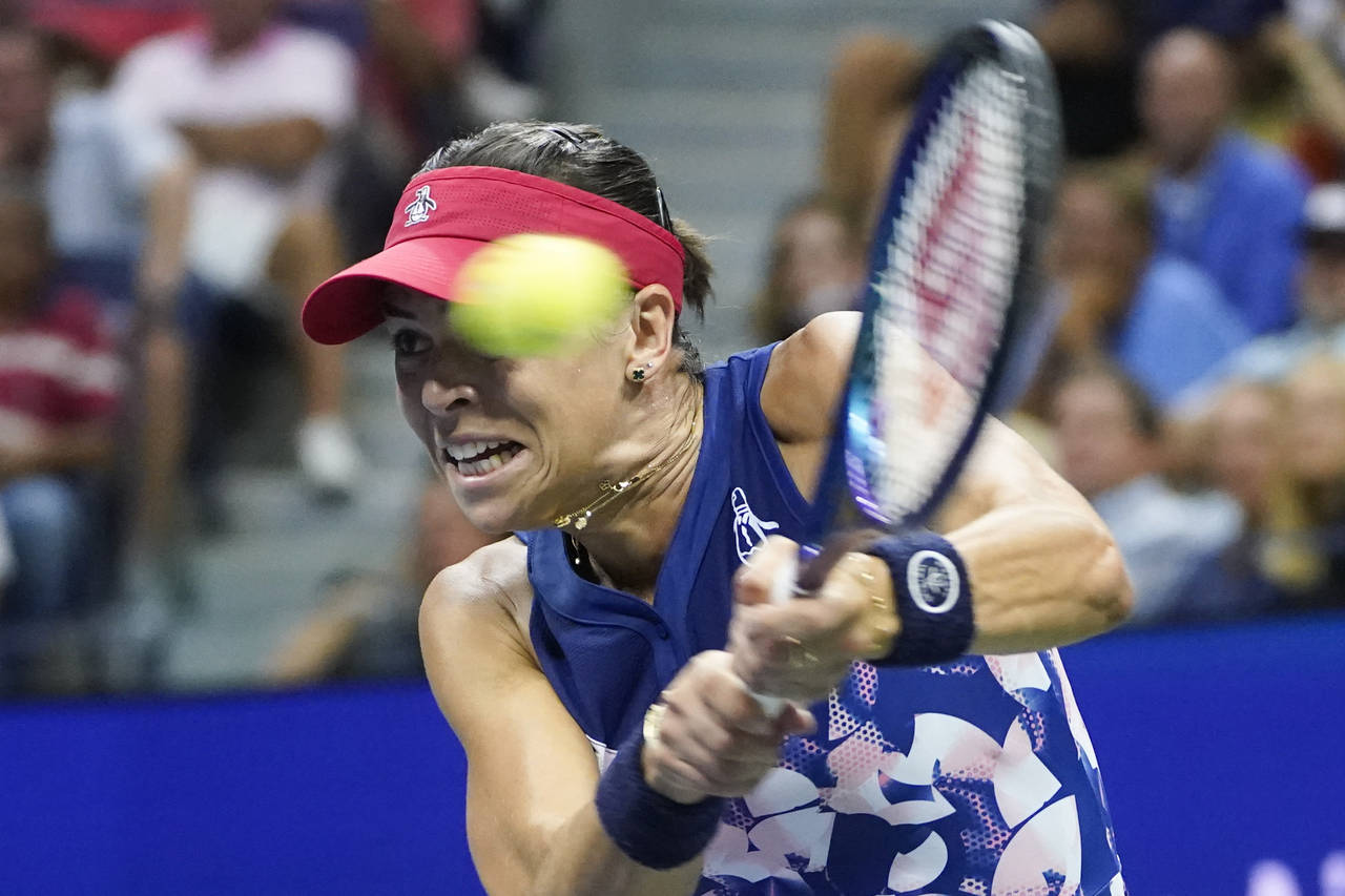 FILE - Ajla Tomljanovic, of Australia, returns a shot to Serena Williams, of the United States, dur...