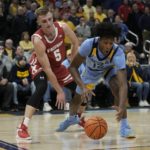 Hepburn paces Wisconsin to 80-77 OT win over Marquette