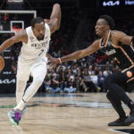 Nets win 10th straight, beating short-handed Hawks 108-107