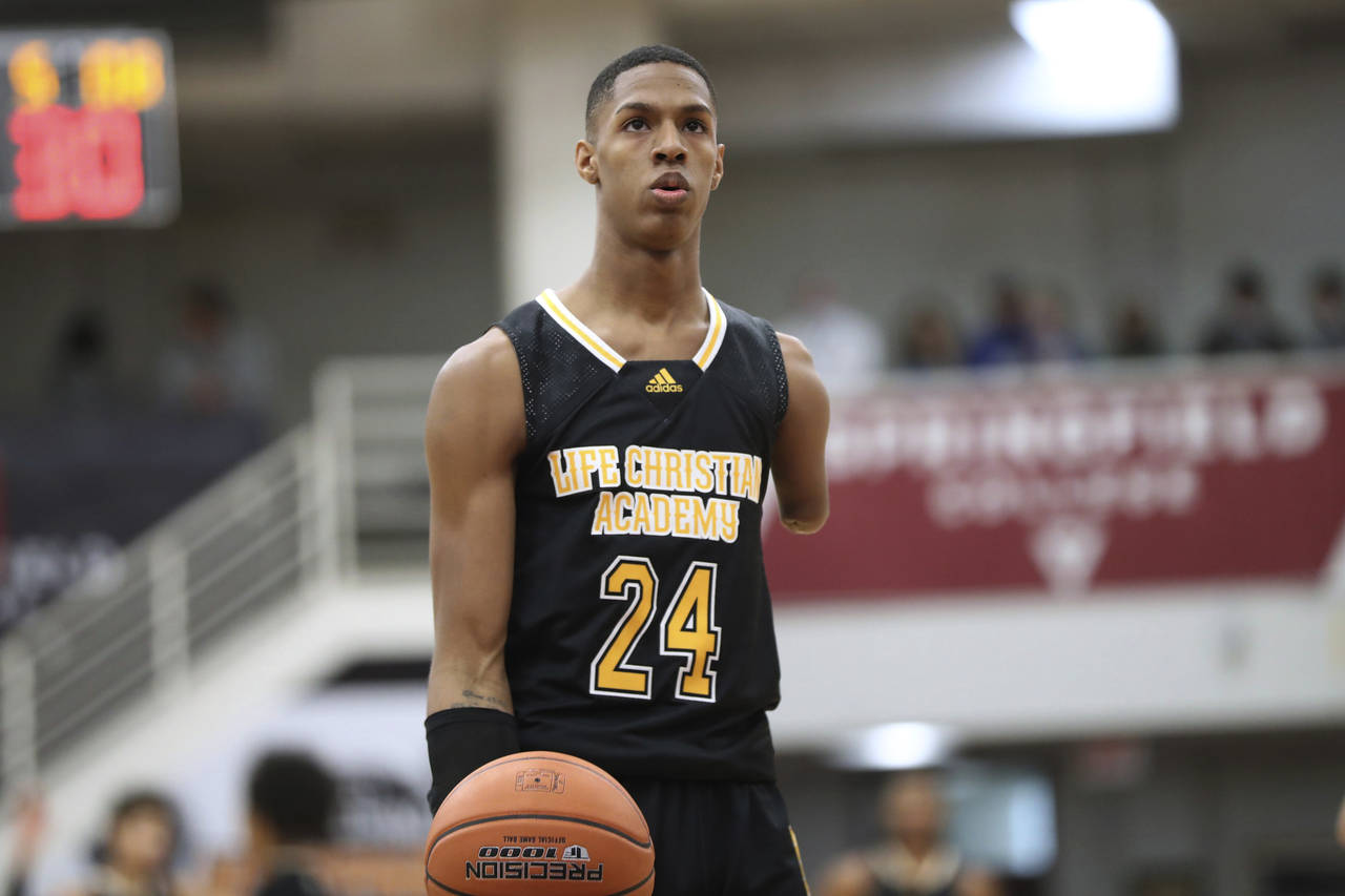 FILE - Life Christian Academy's Hansel Enmanuel Donato gets ready to shoot againsts Wilbraham and M...