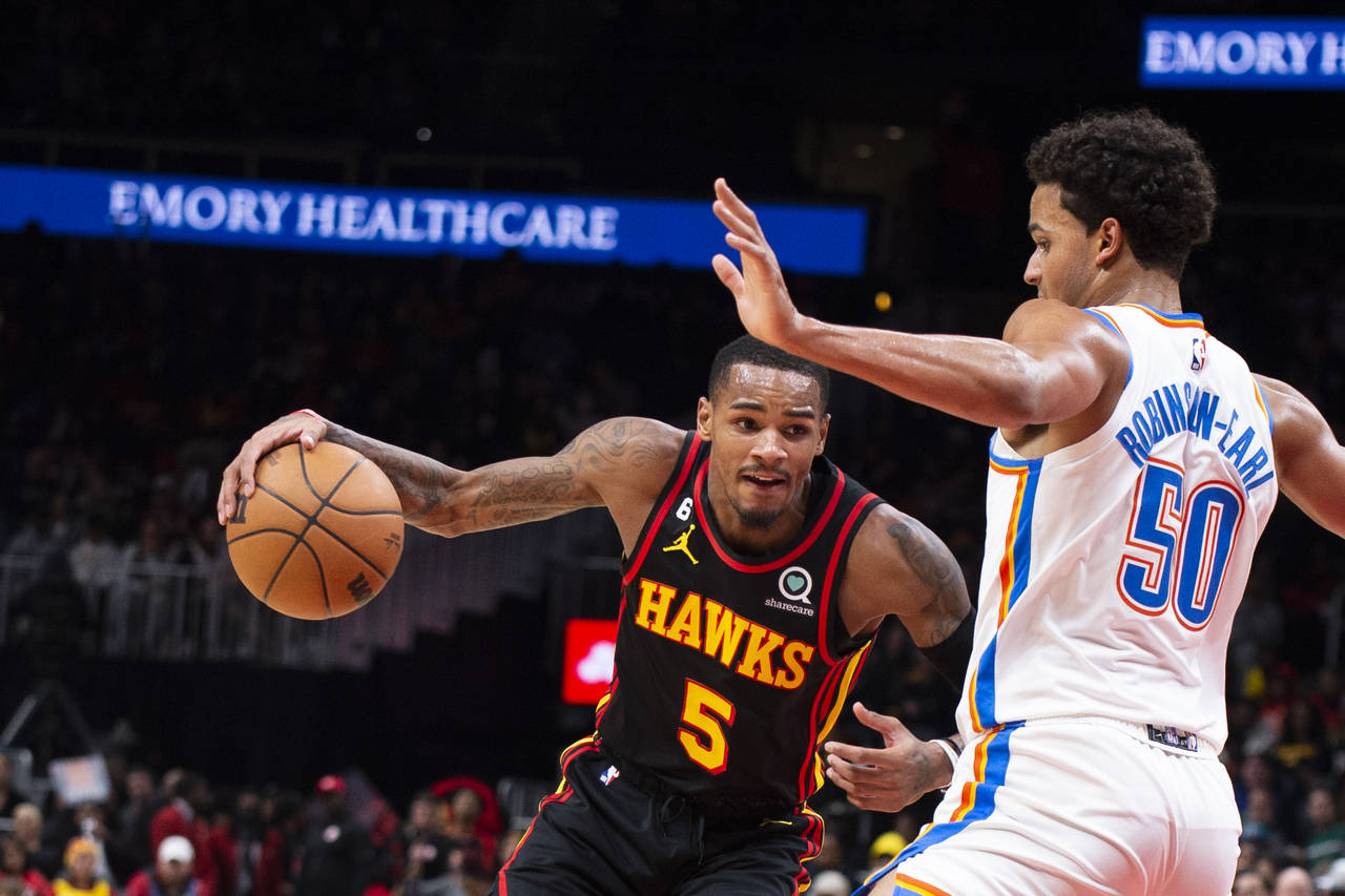 Atlanta Hawks guard Dejounte Murray drives to the basket against Oklahoma City Thunder forward Jere...