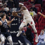 On Popovich's coaching anniversary, Spurs top Heat 115-111