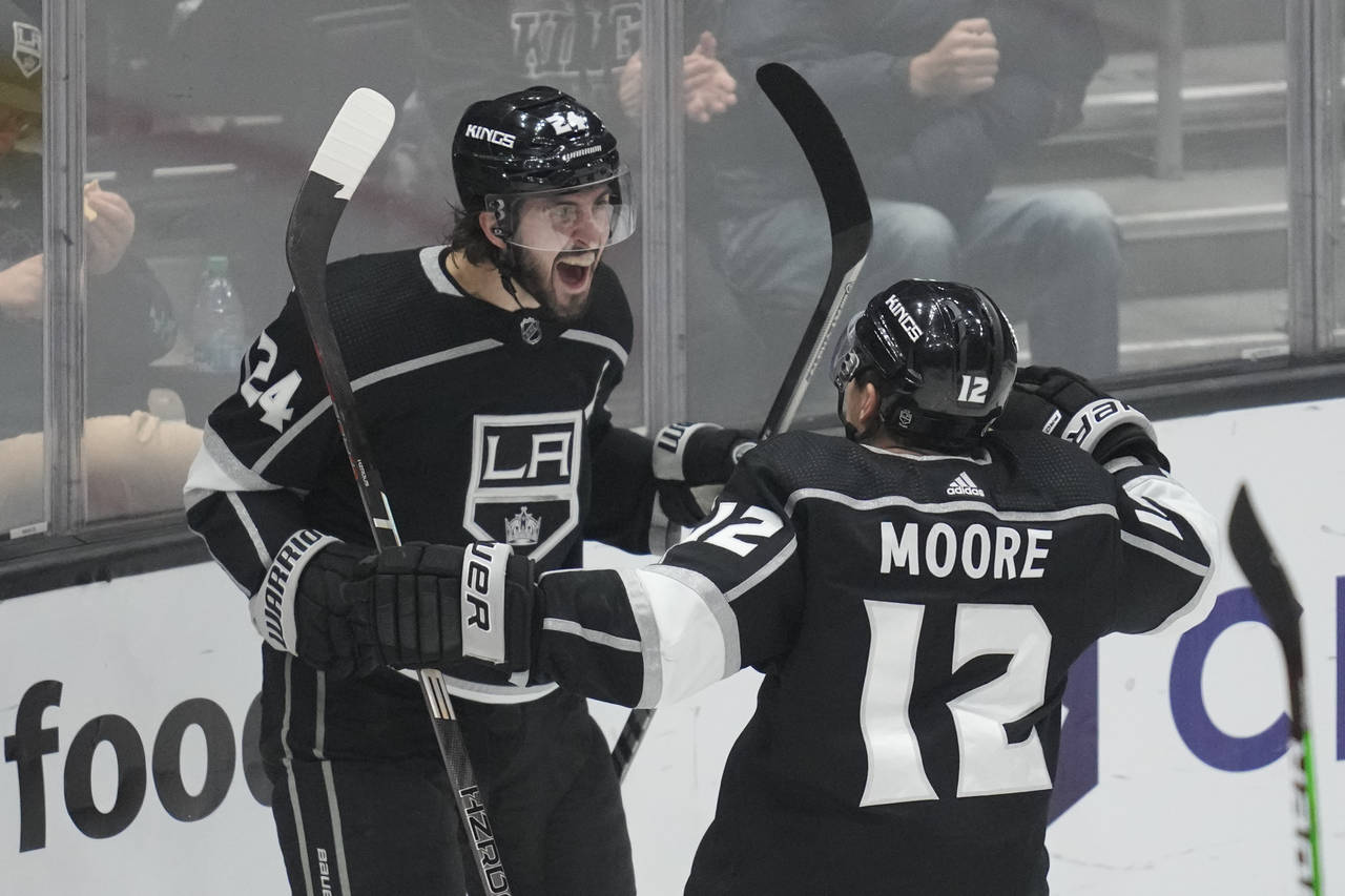Los Angeles Kings center Phillip Danault (24) celebrates with left wing Trevor Moore (12) after sco...