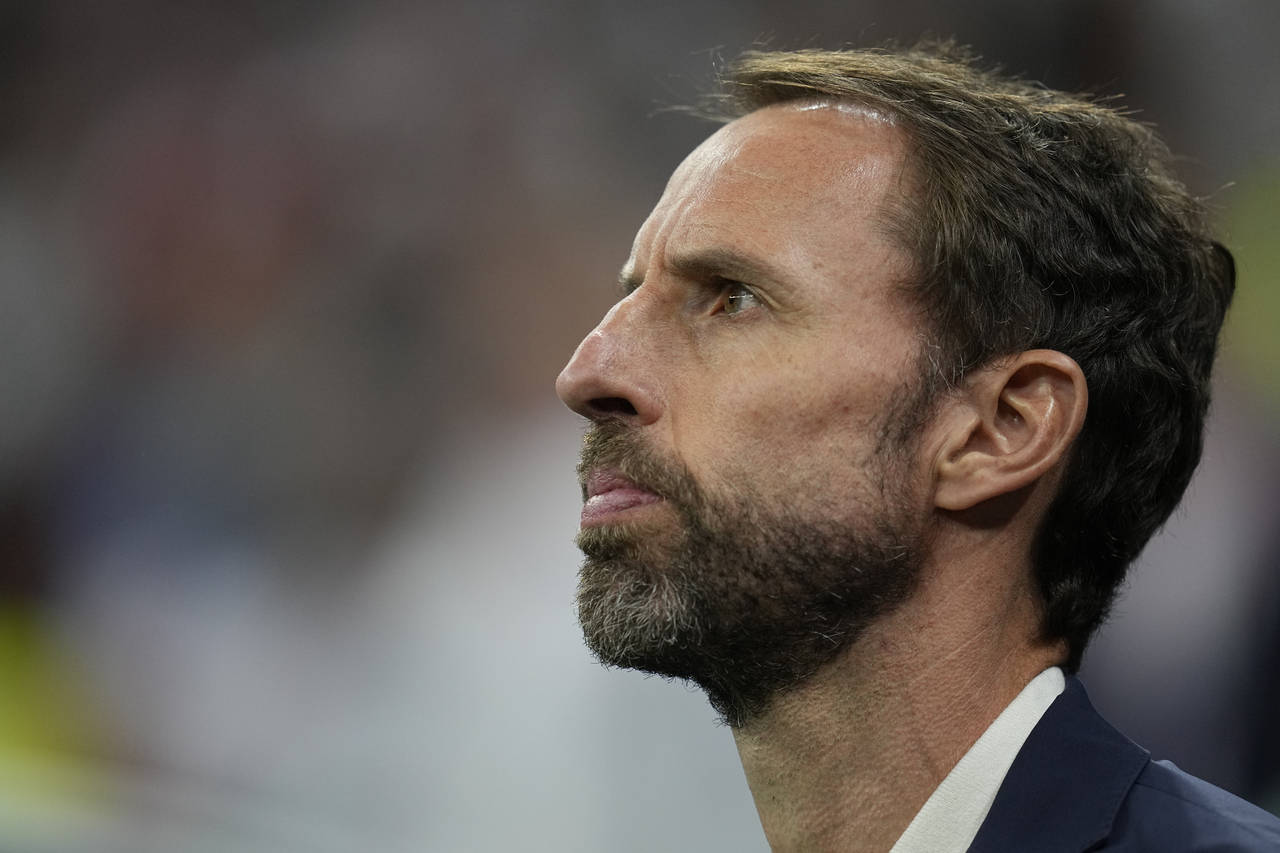 England's head coach Gareth Southgate stands during his national anthem prior to the World Cup quar...