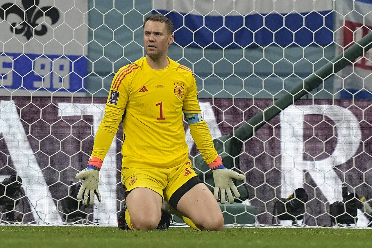 Germany's goalkeeper Manuel Neuer reacts after receiving a goal during the World Cup group E soccer...