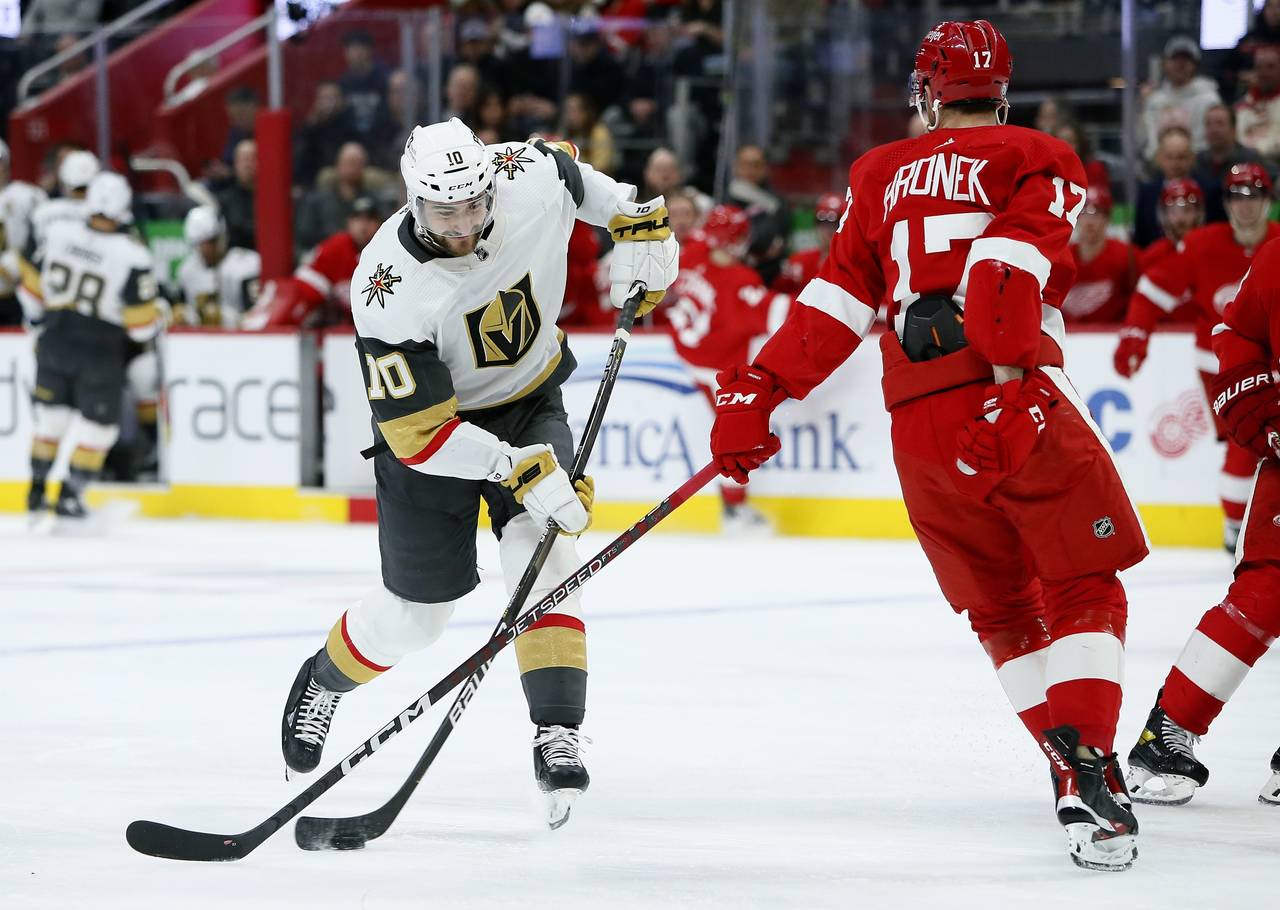 Vegas Golden Knights center Nicolas Roy (10) shoots against Detroit Red Wings defenseman Filip Hron...