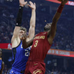 Mitchell scores 34, Cavaliers top Magic 107-96