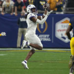 No. 3 TCU upsets No. 2 Michigan 51-45 in wild CFP semifinal