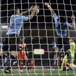 Suarez a World Cup great for Uruguay, 'the devil' for others