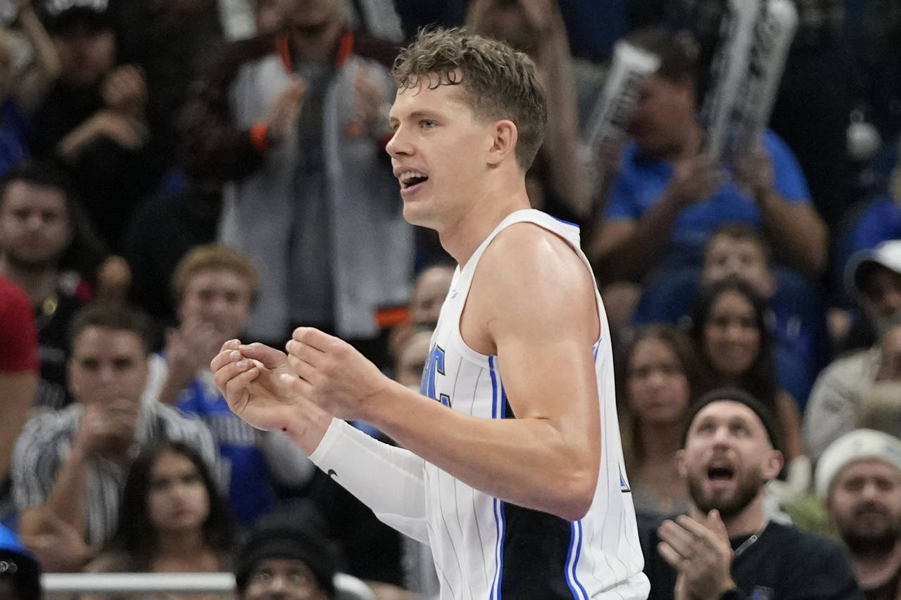 Orlando Magic's Moritz Wagner reacts after drawing a charging foul from Toronto Raptors' Gary Trent...