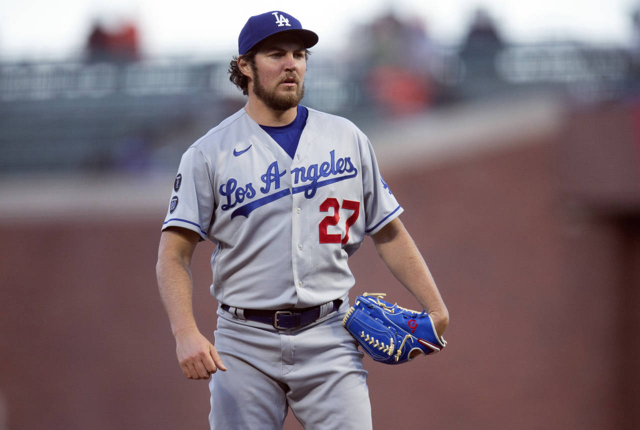 FILE - Los Angeles Dodgers starting pitcher Trevor Bauer pauses while working against the San Franc...