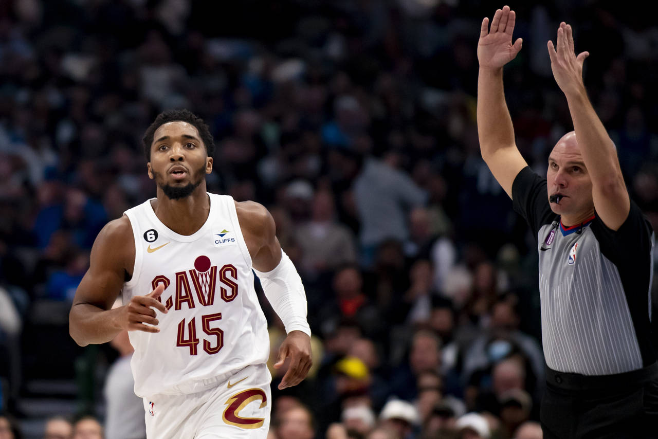 Cleveland Cavaliers guard Donovan Mitchell (45) jogs down the floor after hitting a three point sho...