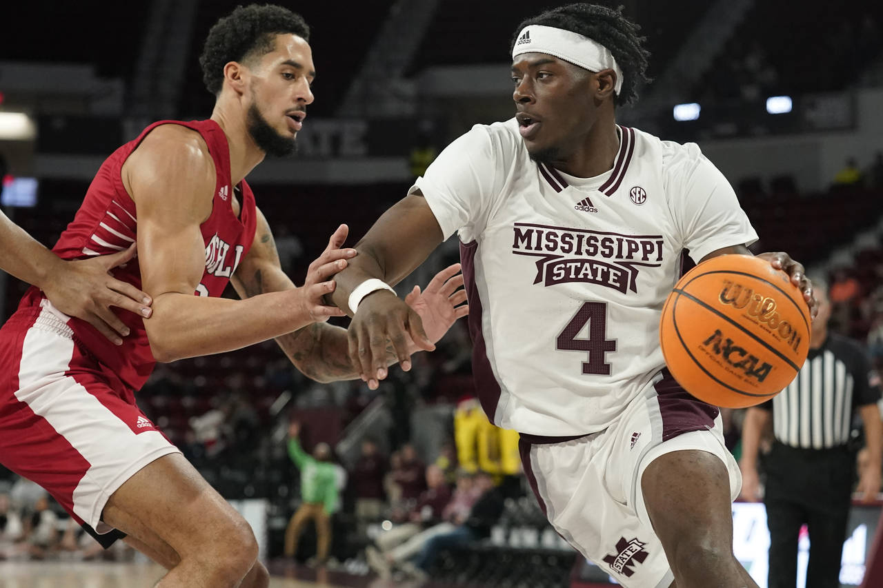 Mississippi State guard Cameron Matthews (4) drives up court against Nicholls State forward Marek N...