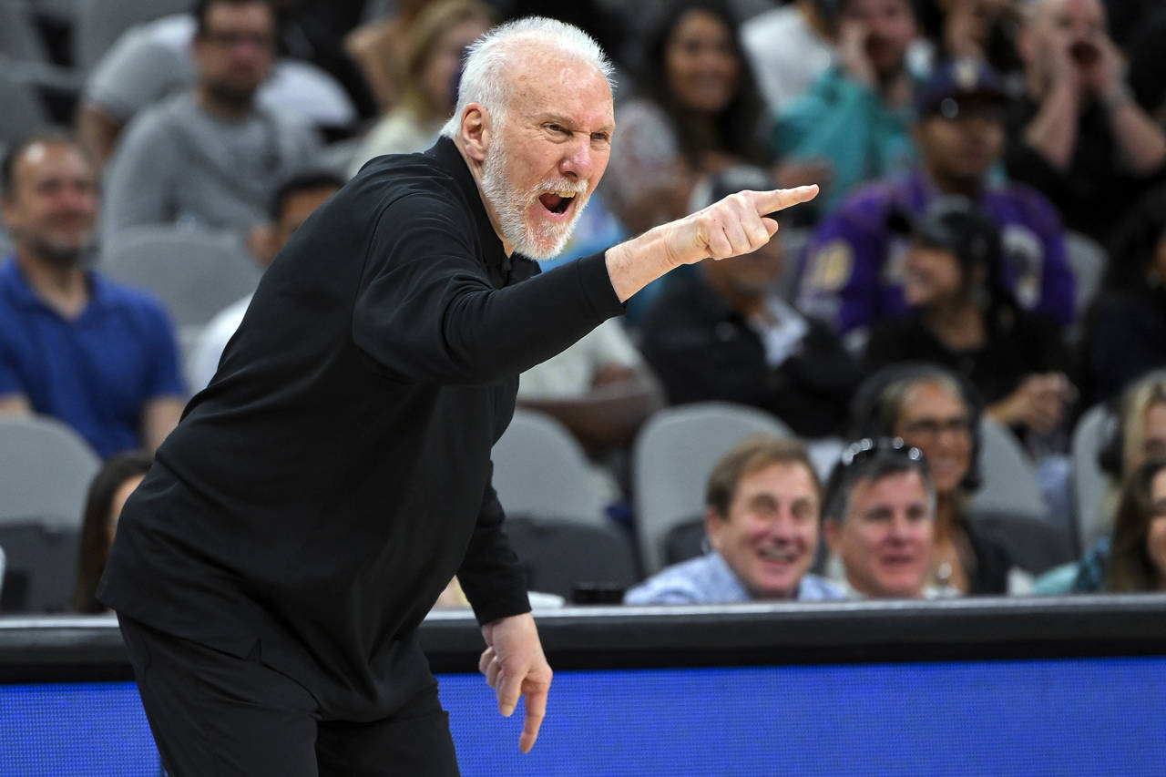 San Antonio Spurs head coach Gregg Popovich yells to his players during the second half of an NBA b...