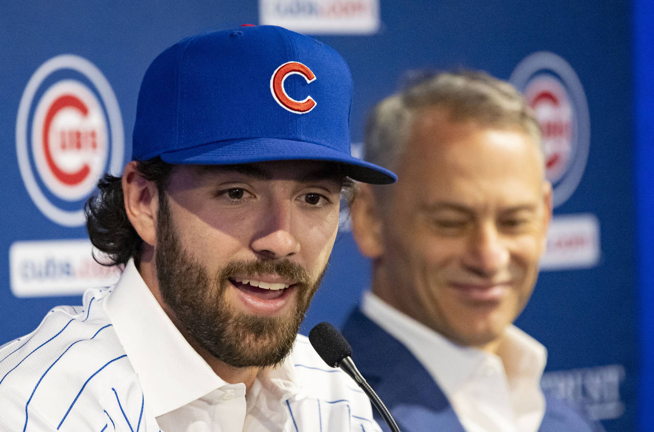 All-Star shortstop Dansby Swanson, alongside Jed Hoyer, Chicago Cubs president of baseball operatio...