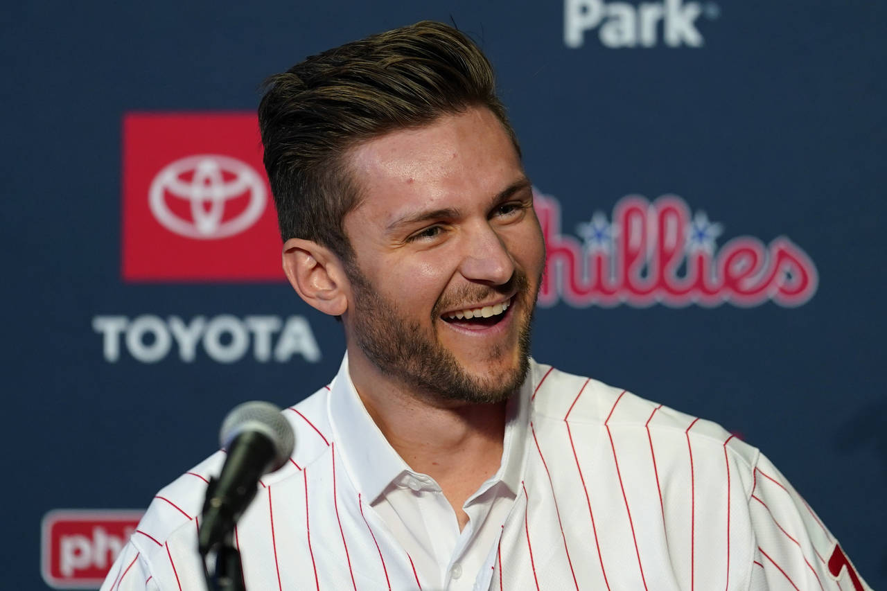 Newly acquired Philadelphia Phillies shortstop Trea Turner laughs during his introductory news conf...