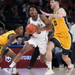 Roach leads No. 15 Duke past Iowa 74-62 in Jimmy V Classic