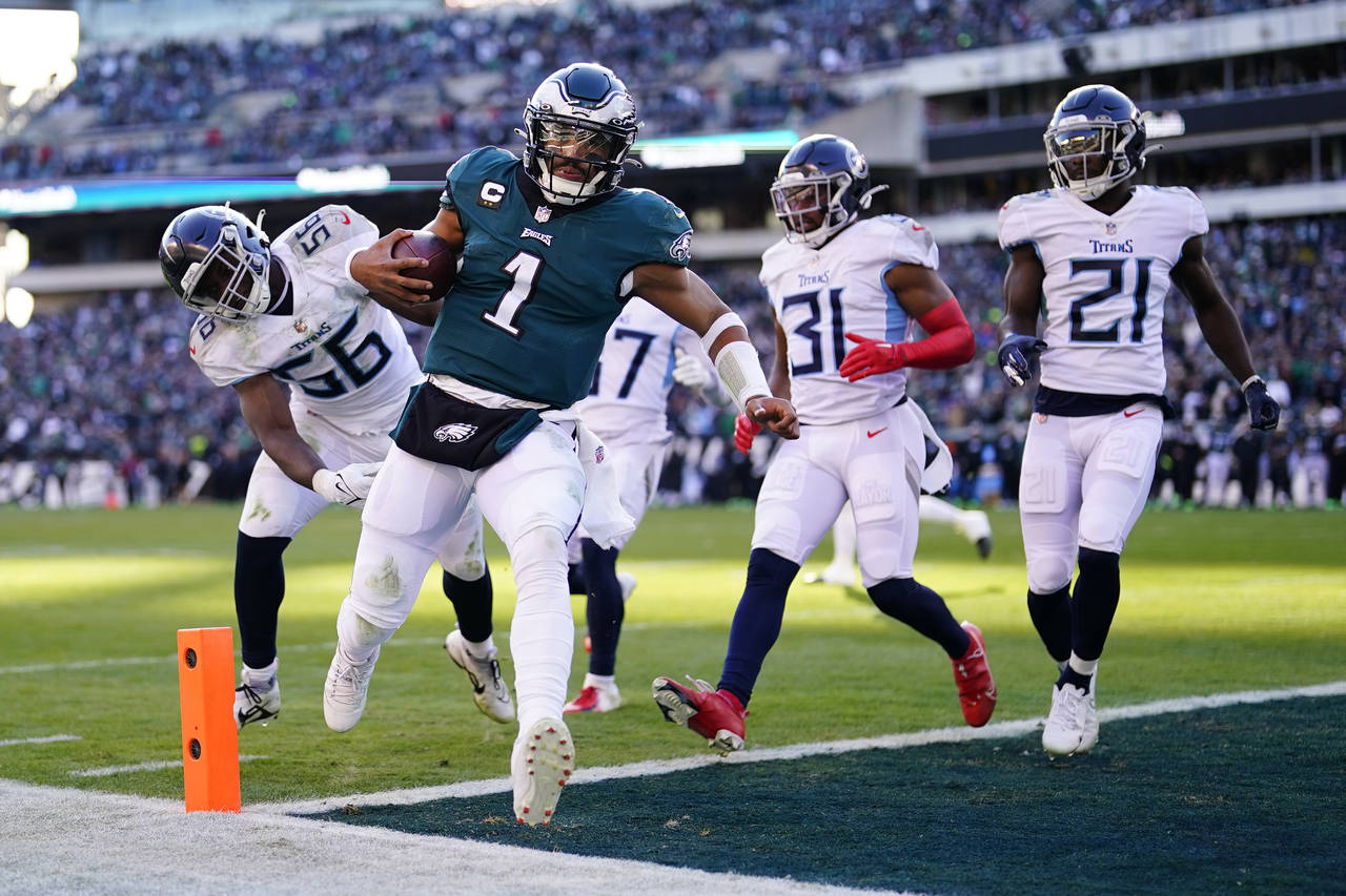 Philadelphia Eagles' Jalen Hurts scores a touchdown during the first half of an NFL football game a...
