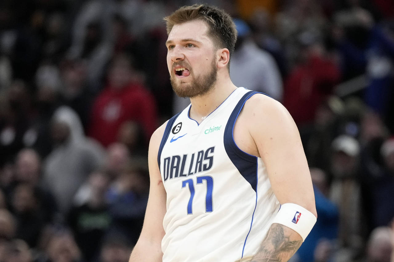 Dallas Mavericks guard Luka Doncic reacts after making a 3-point basket during the second half of a...