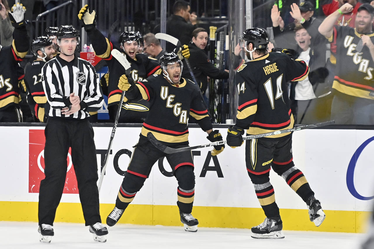 Vegas Golden Knights right wing Keegan Kolesar (55) and defenseman Nicolas Hague (14) react after H...