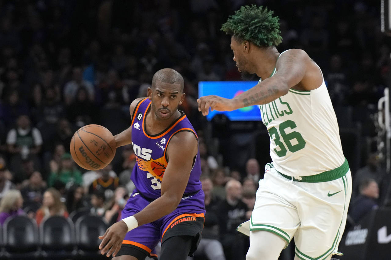 Phoenix Suns guard Chris Paul drives on Boston Celtics guard Marcus Smart (36) during the second ha...