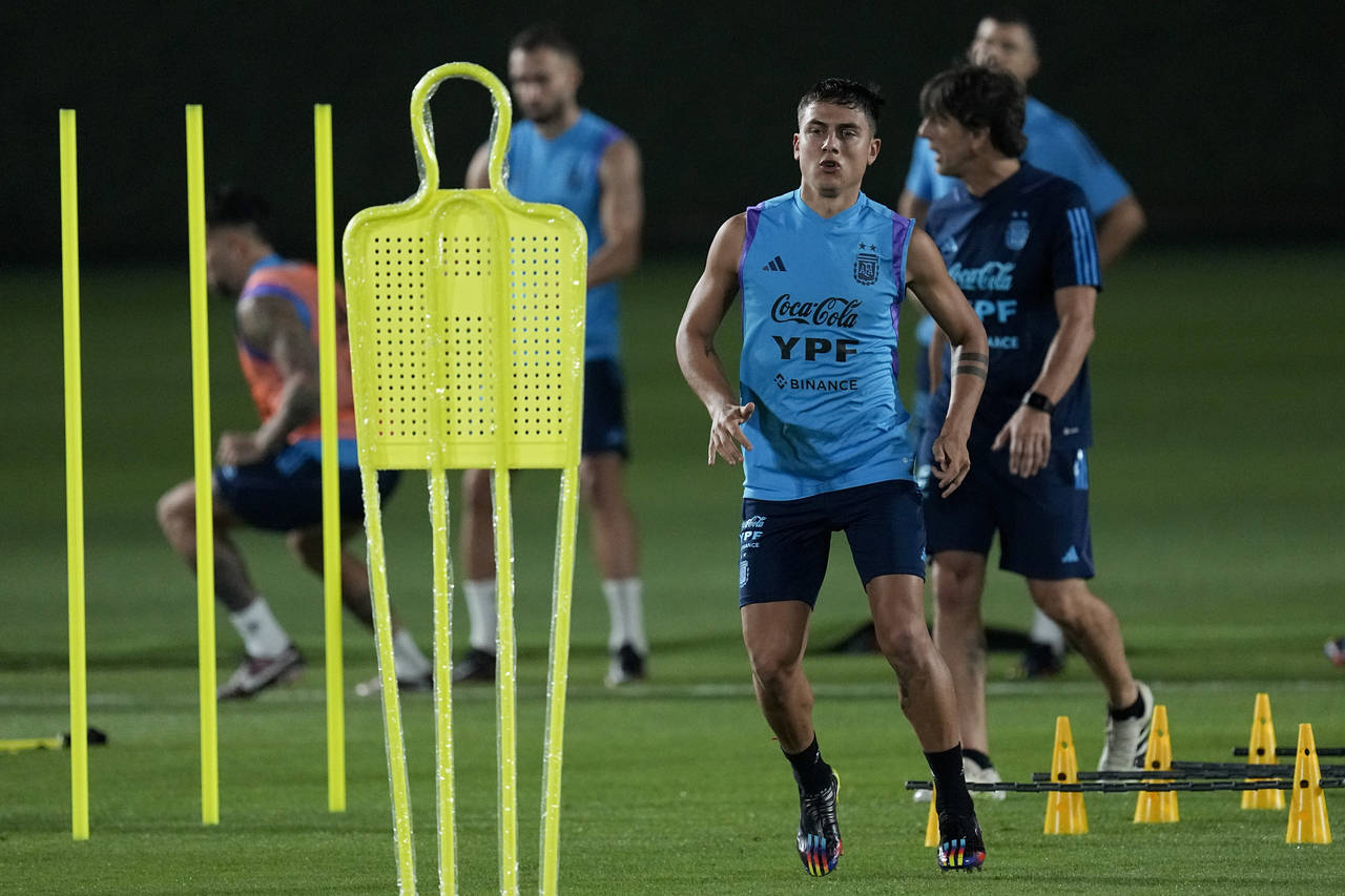 Paulo Dybala runs during a training session of Argentina's national soccer team in Doha, Saturday, ...