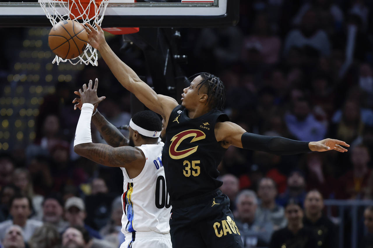 Cleveland Cavaliers forward Isaac Okoro (35) rebounds against Brooklyn Nets forward Royce O'Neale (...