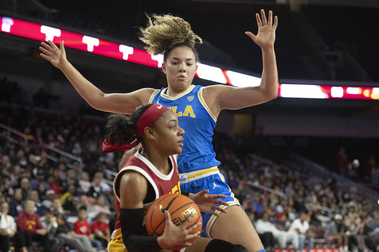 FILE - UCLA guard Kiki Rice, rear, guards Southern California guard Kayla Williams (4) during an NC...