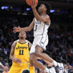 Roach leads No. 15 Duke past Iowa 74-62 in Jimmy V Classic