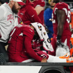 Cardinals' Murray hurts knee vs. Patriots, carted off field