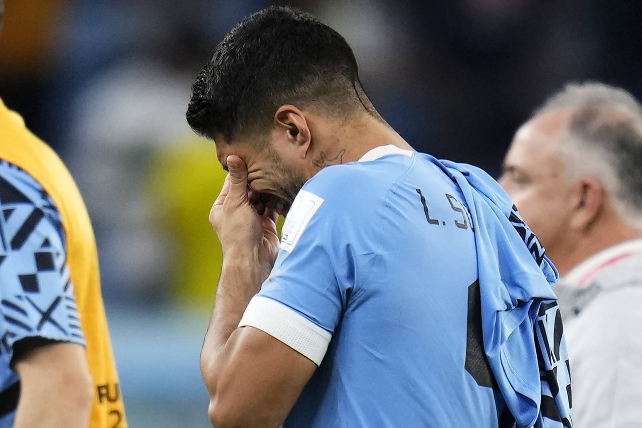 Uruguay's Luis Suarez cries after the World Cup group H soccer match between Ghana and Uruguay, at ...