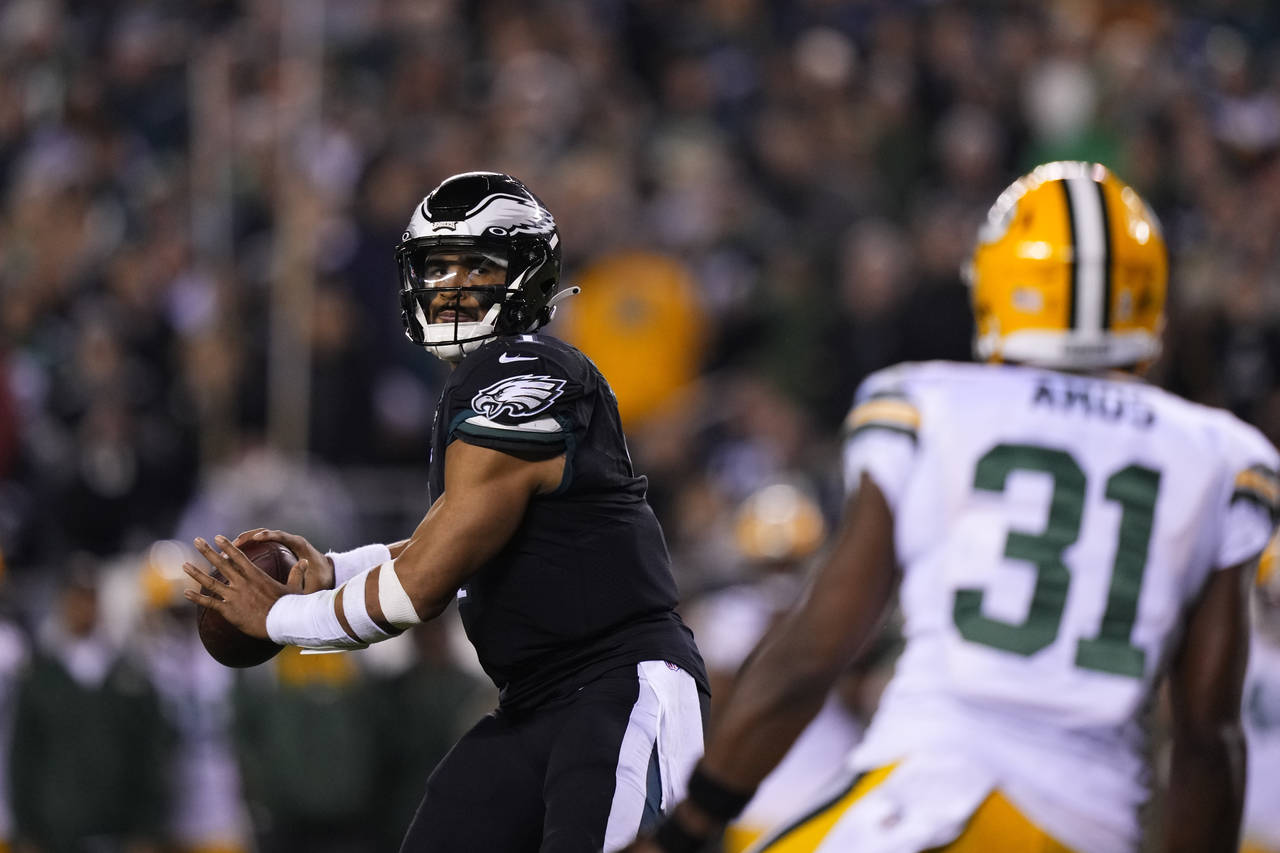 Philadelphia Eagles quarterback Jalen Hurts (1) throws a touchdown pass during the second half of a...