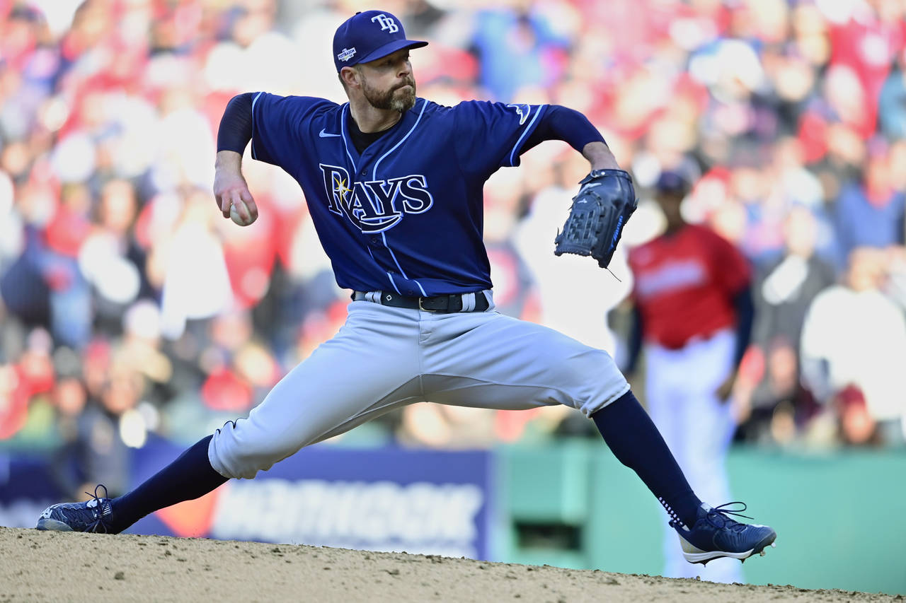 FILE - Tampa Bay Rays' Corey Kluber pitches in the 13th inning of a wild card baseball playoff game...