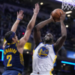 Curry injures shoulder, Pacers hold off Warriors 125-119