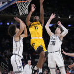 Roach leads No. 15 Duke past Iowa 74-62 in Jimmy V Classic
