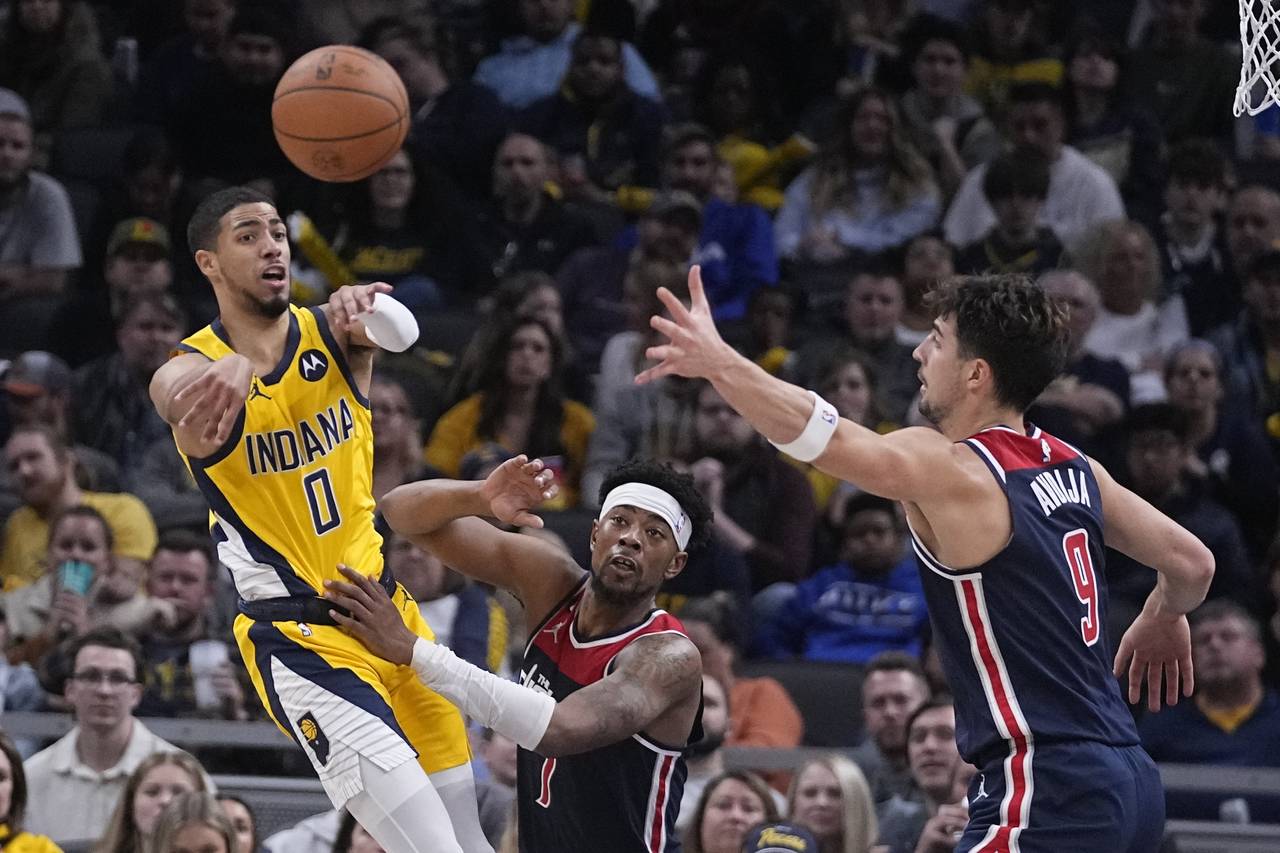 Indiana Pacers guard Tyrese Haliburton (0) passes the ball against Washington Wizards guard Jordan ...