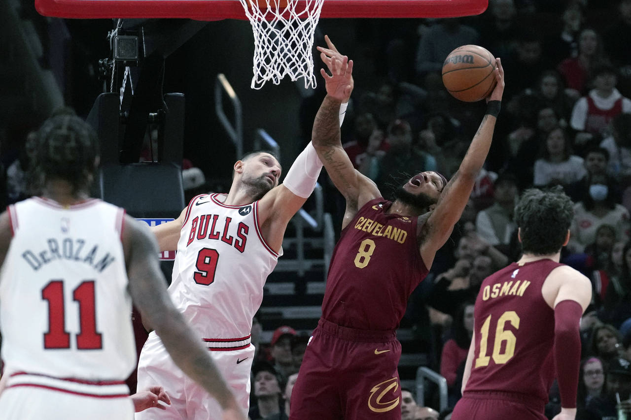 Cleveland Cavaliers forward Lamar Stevens (8) rebounds the ball against Chicago Bulls center Nikola...