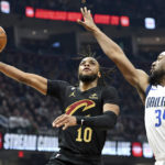 Cavaliers beat Mavericks 100-99 in OT on Allen's slam