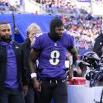 Lamar Jackson leaves game with knee injury after sack