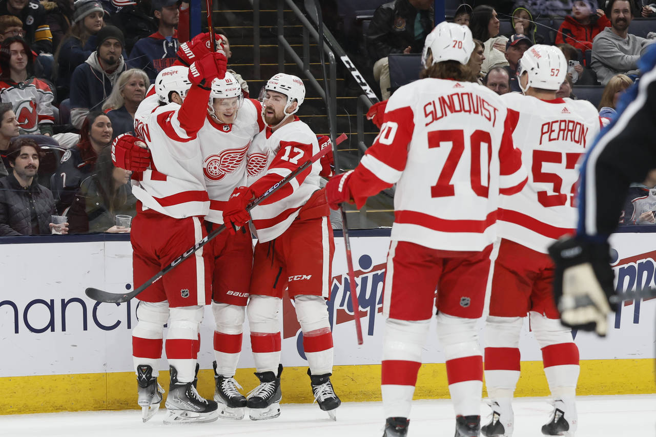Detroit Red Wings players celebrate their goal against the Columbus Blue Jackets during the first p...