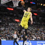 Vassell, Johnson help Spurs hold on to beat Jazz, 126-122