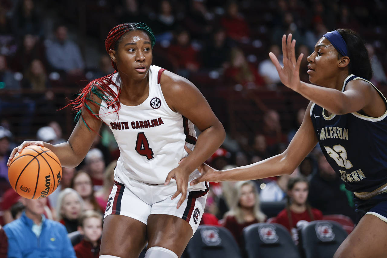 South Carolina forward Aliyah Boston (4) drives against Charleston Southern forward Saniya Jones du...