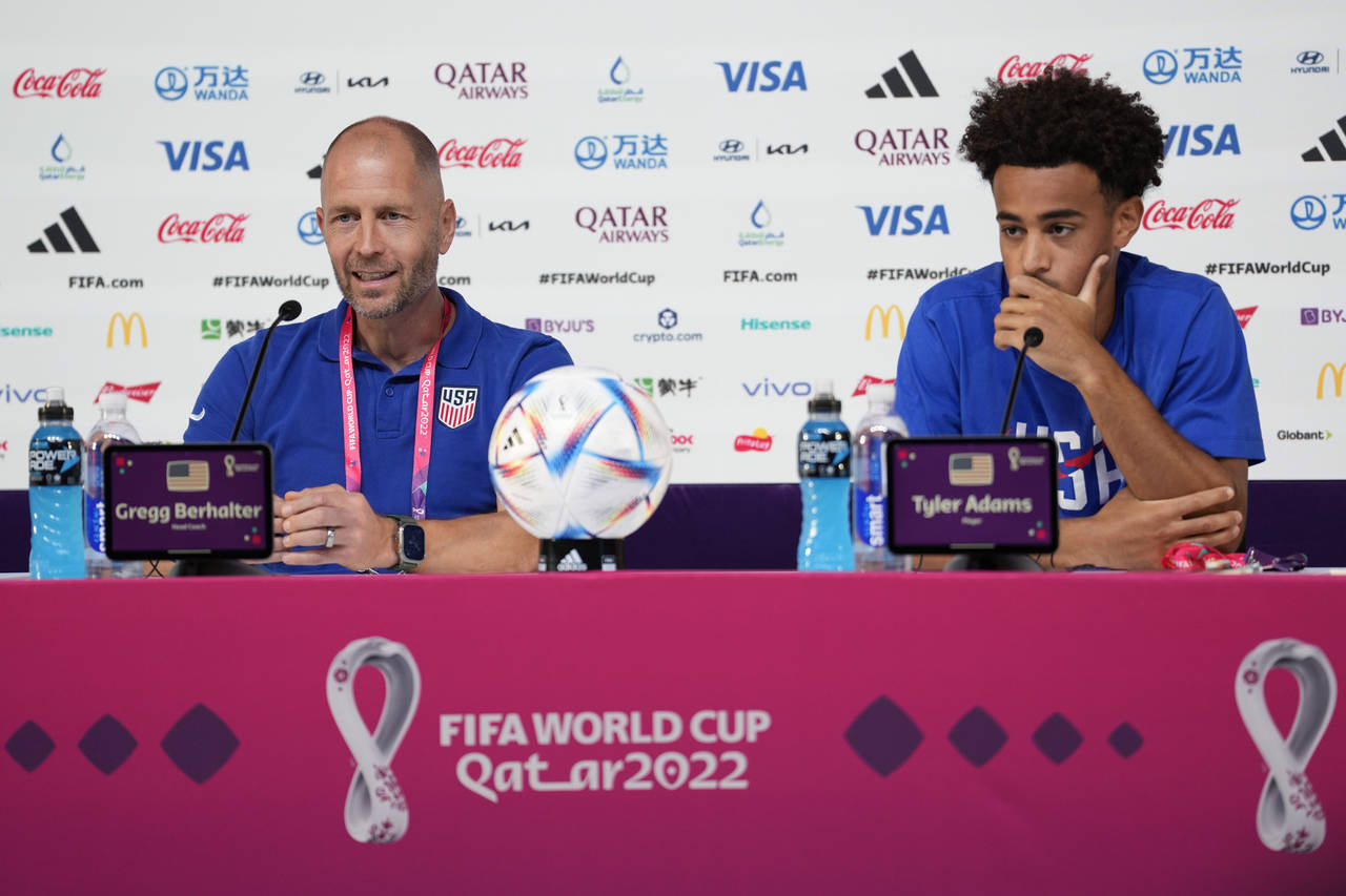 Head coach Gregg Berhalter, left, and Tyler Adams, both of the United States attend a press confere...