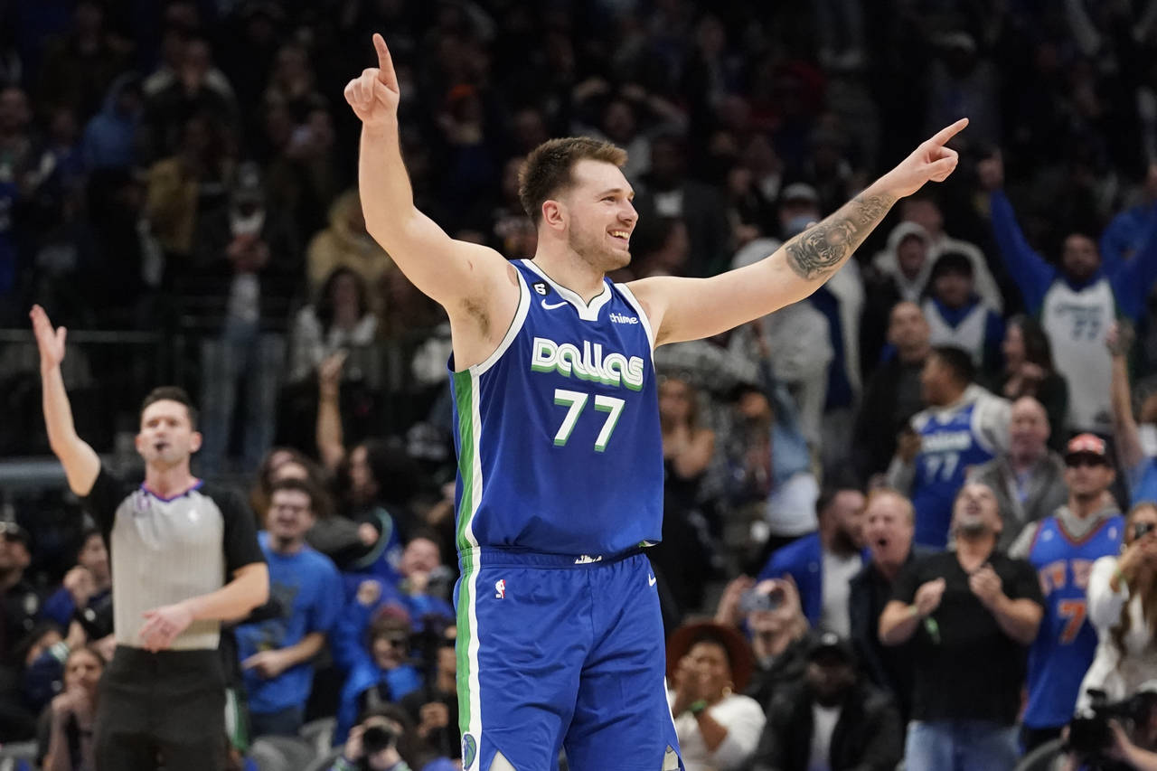 Dallas Mavericks guard Luka Doncic (77) celebrates scoring the game tying basket during the fourth ...