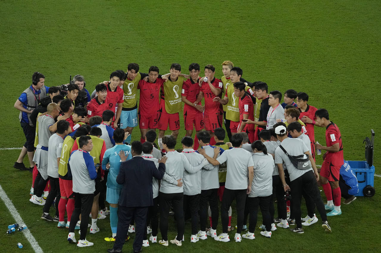 South Korea's team players wait for the result of their group's match between Ghana and Uruguay, af...