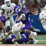 
              Washington running back Richard Newton (6) runs against Texas during the first half of the Alamo Bowl NCAA college football game in San Antonio, Thursday, Dec. 29, 2022. (AP Photo/Eric Gay)
            