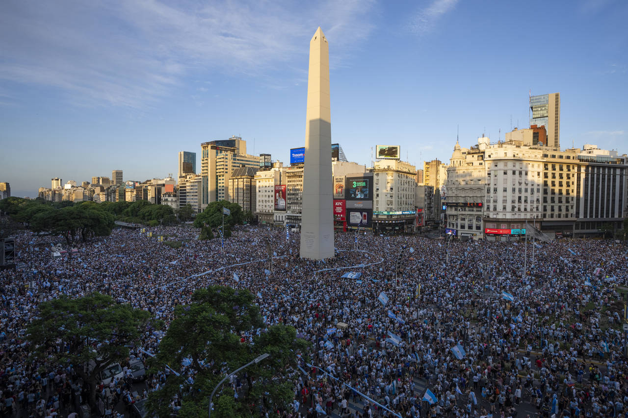 Argentina soccer fans celebrate their team's victory over Croatia in a World Cup semifinal match, b...
