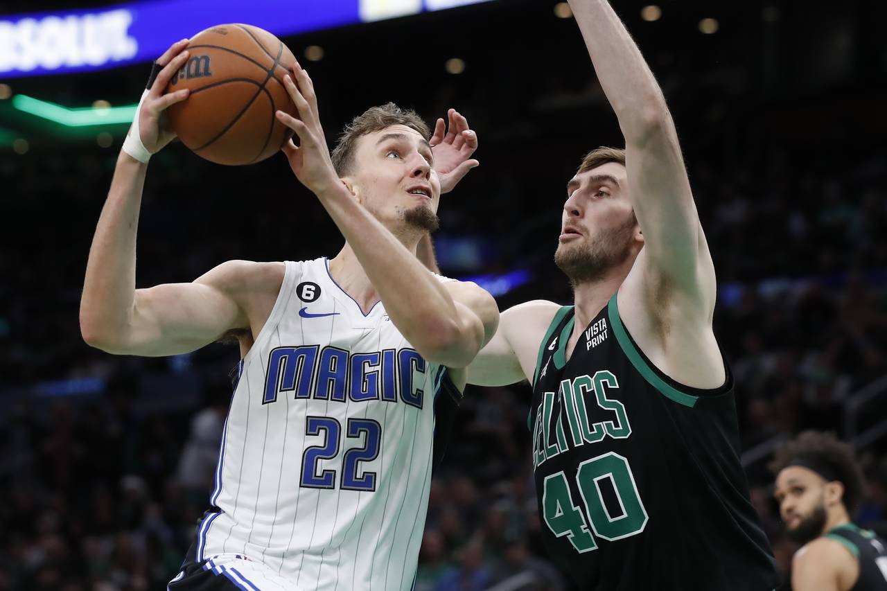 Orlando Magic's Franz Wagner (22) shoots against Boston Celtics' Luke Kornet (40) during the second...