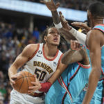 Jokic, Nuggets outlast Suns 128-125 in OT; Booker sidelined