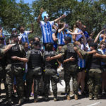 Sea of people try to catch glimpse of Argentina soccer team